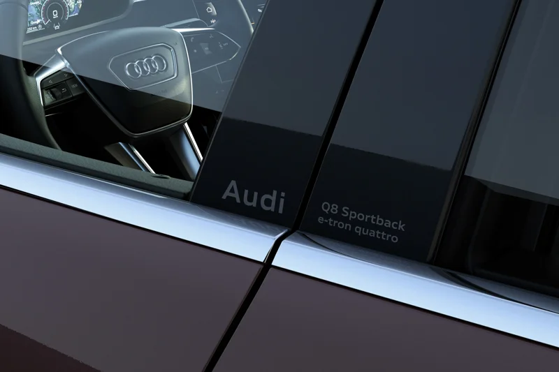 Model lettering with an Audi logo on the B-pillar